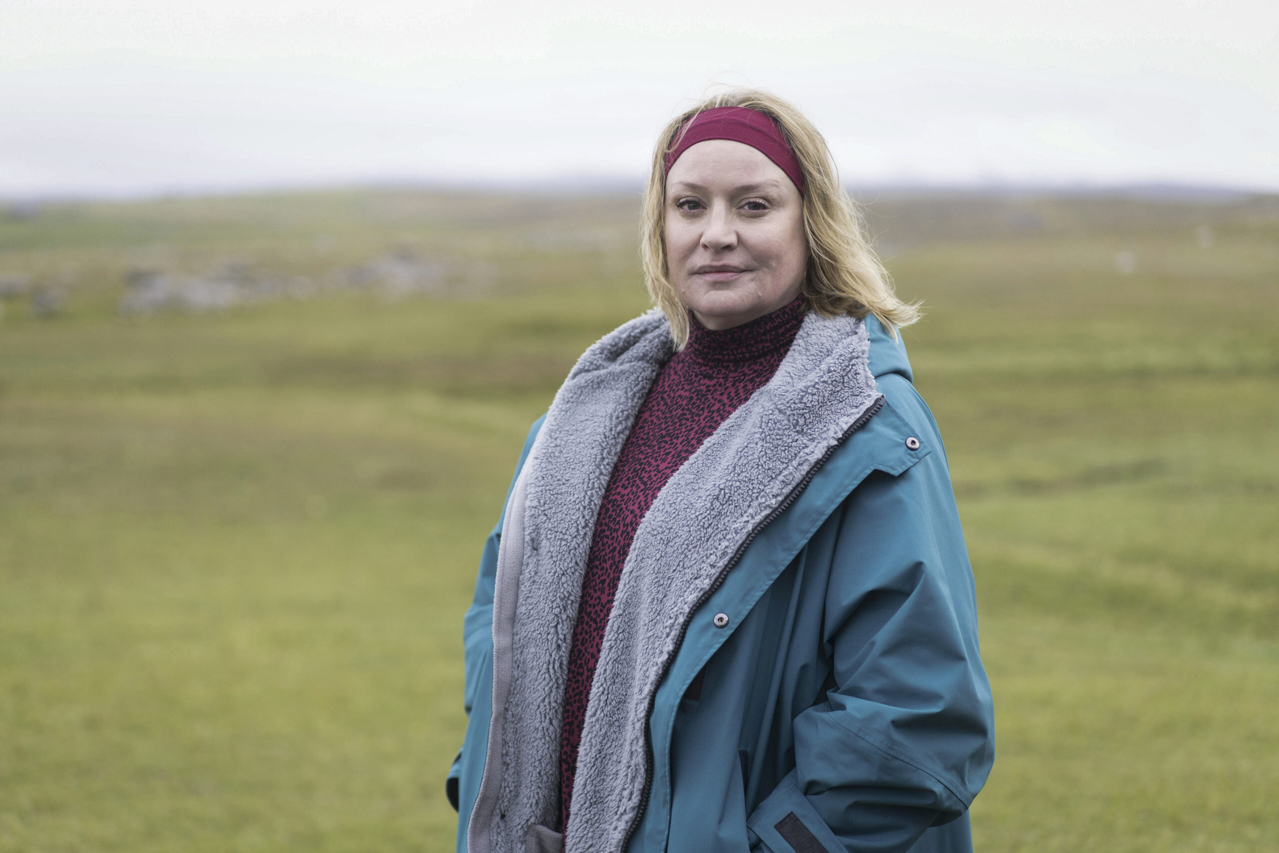 Shetland,Generic Portraits,Alison Woods (LAURIE BRETT) She stands in a Shetland field, smiling at the camera in a green coat