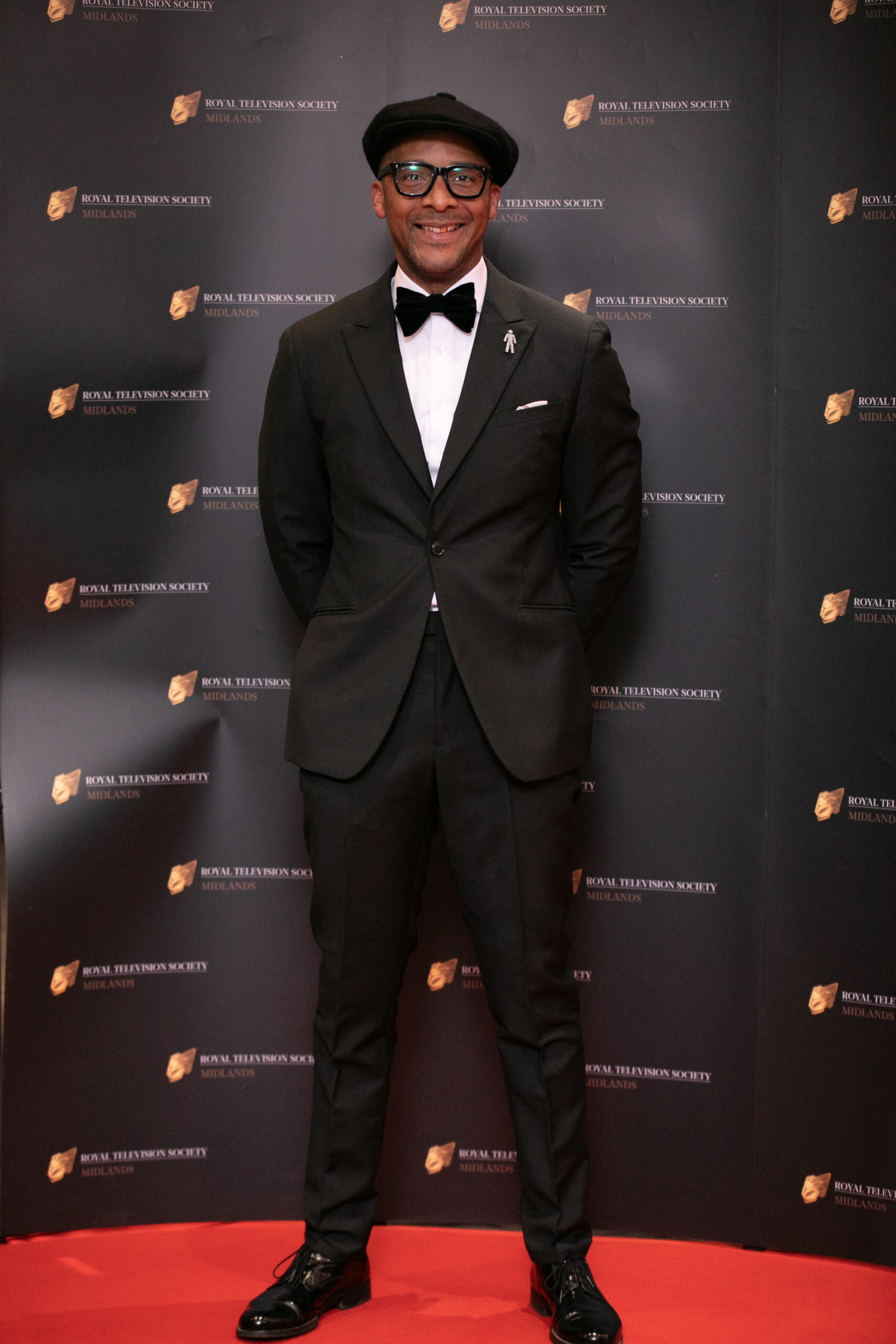 Jay Blades smiles on red carpet at event