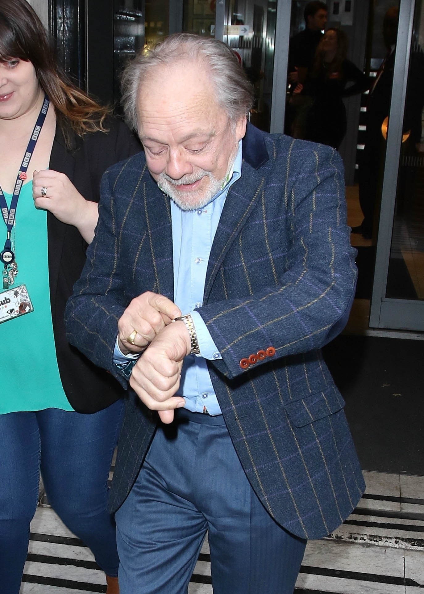 Sir David Jason wearing a navy suit and smiling