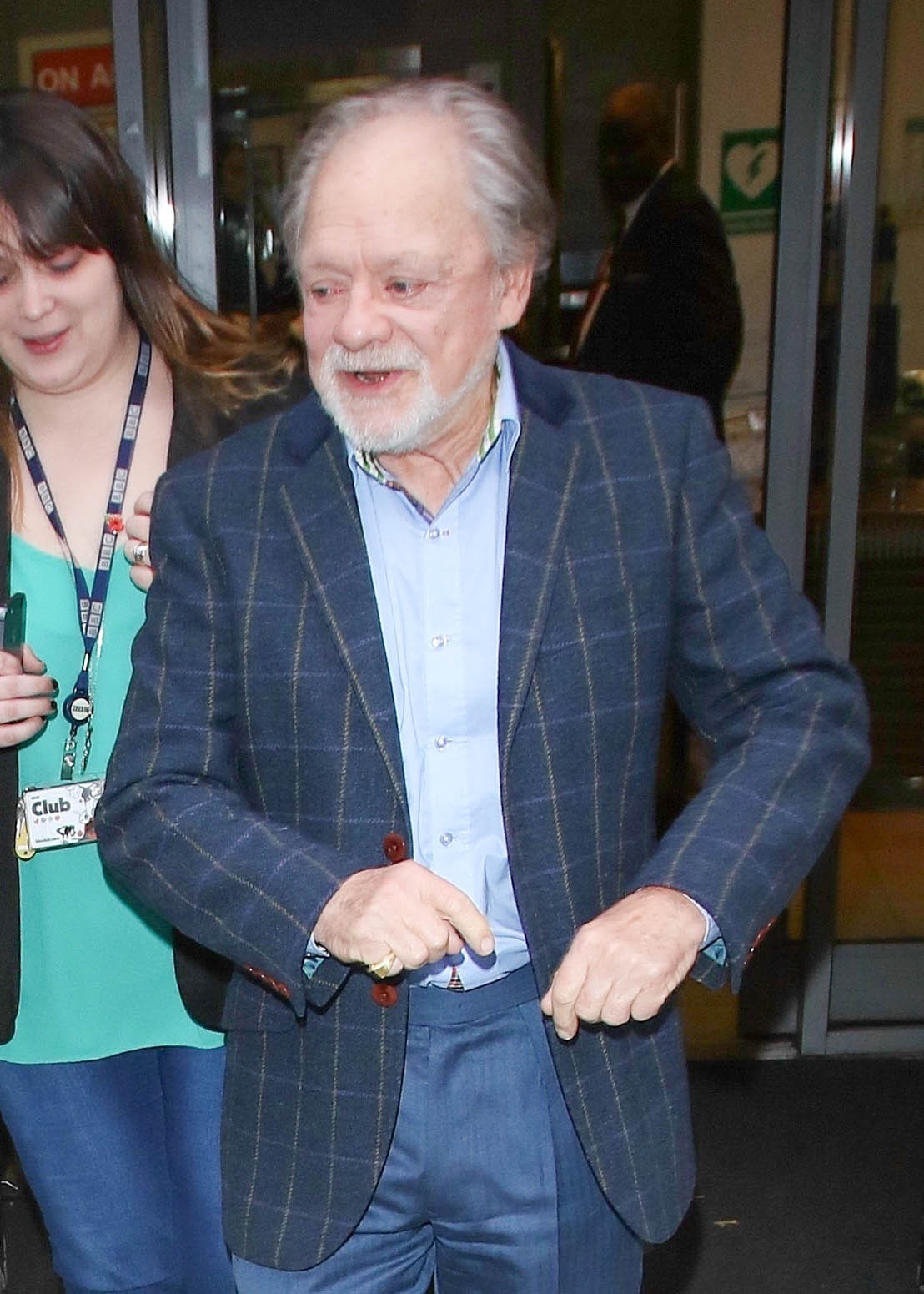 Sir David Jason wearing a navy suit and smiling