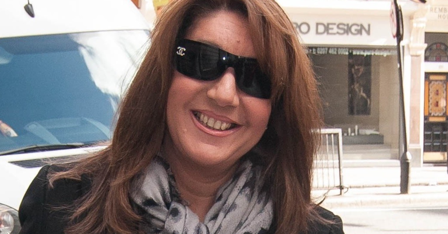 Jane McDonald wearing sunglasses and smiling