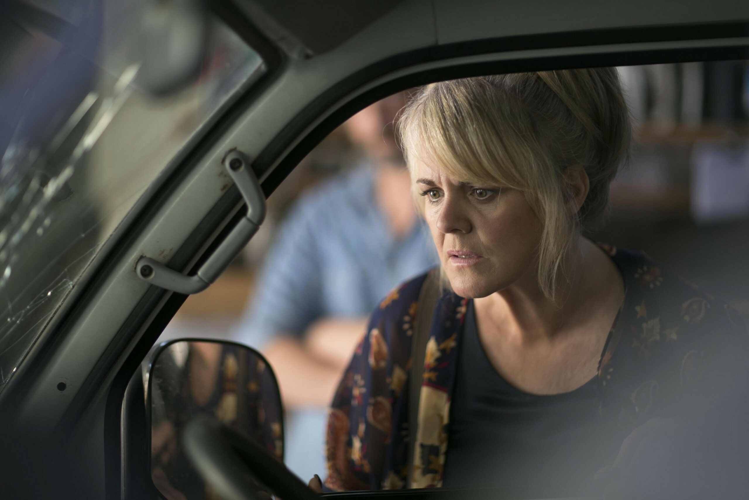 Sally Lindsay looks troubled in a car as Jean in The Madame Blanc Mysteries in Season 1