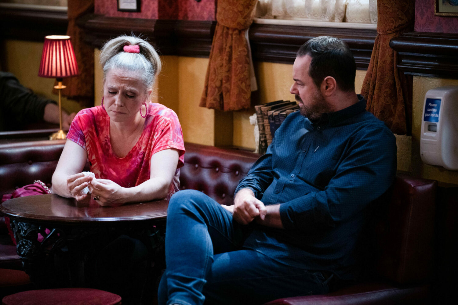 Linda and Mick Carter talk seriously in the Vic