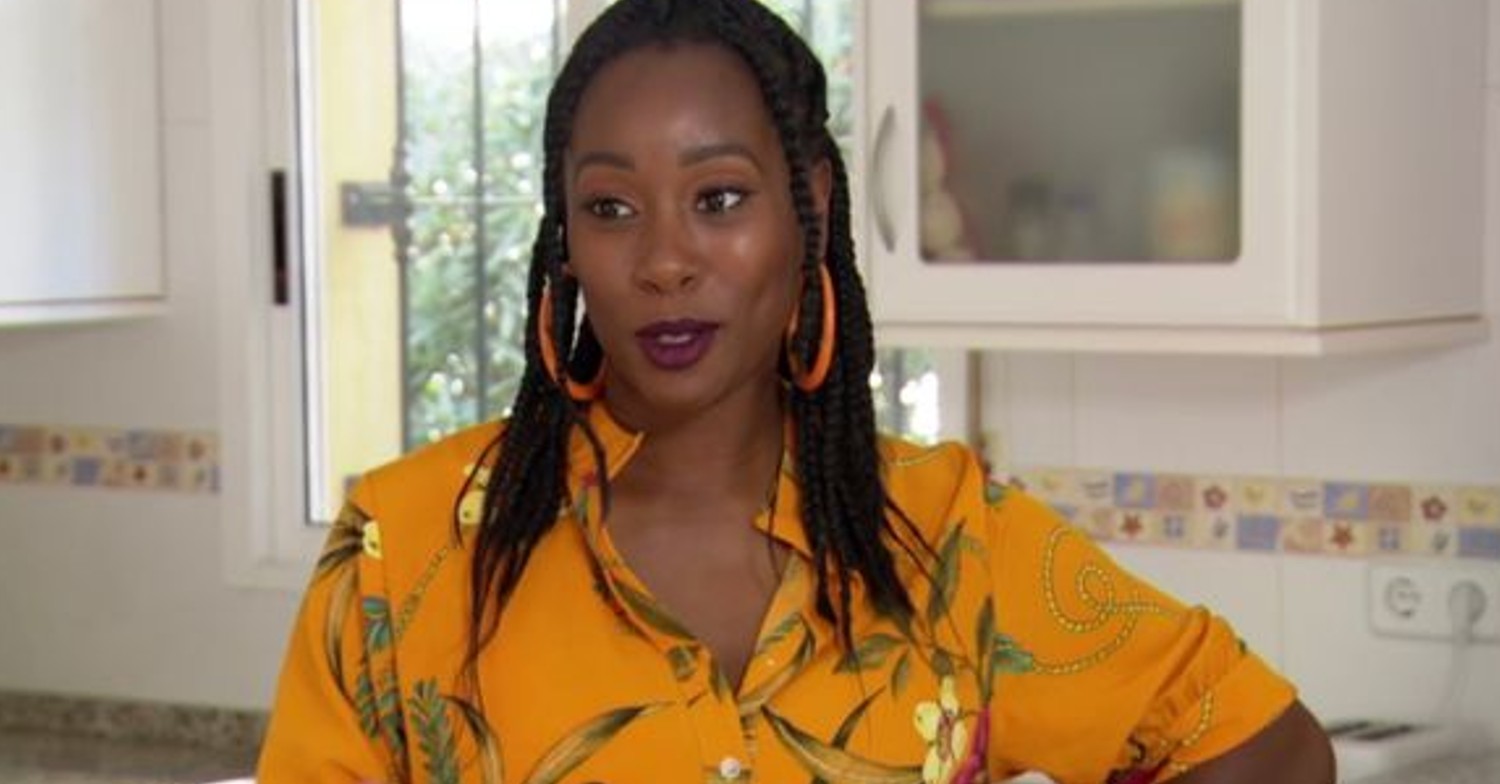 A Place In The Sun presenter Scarlette Douglas smiling and wearing yellow