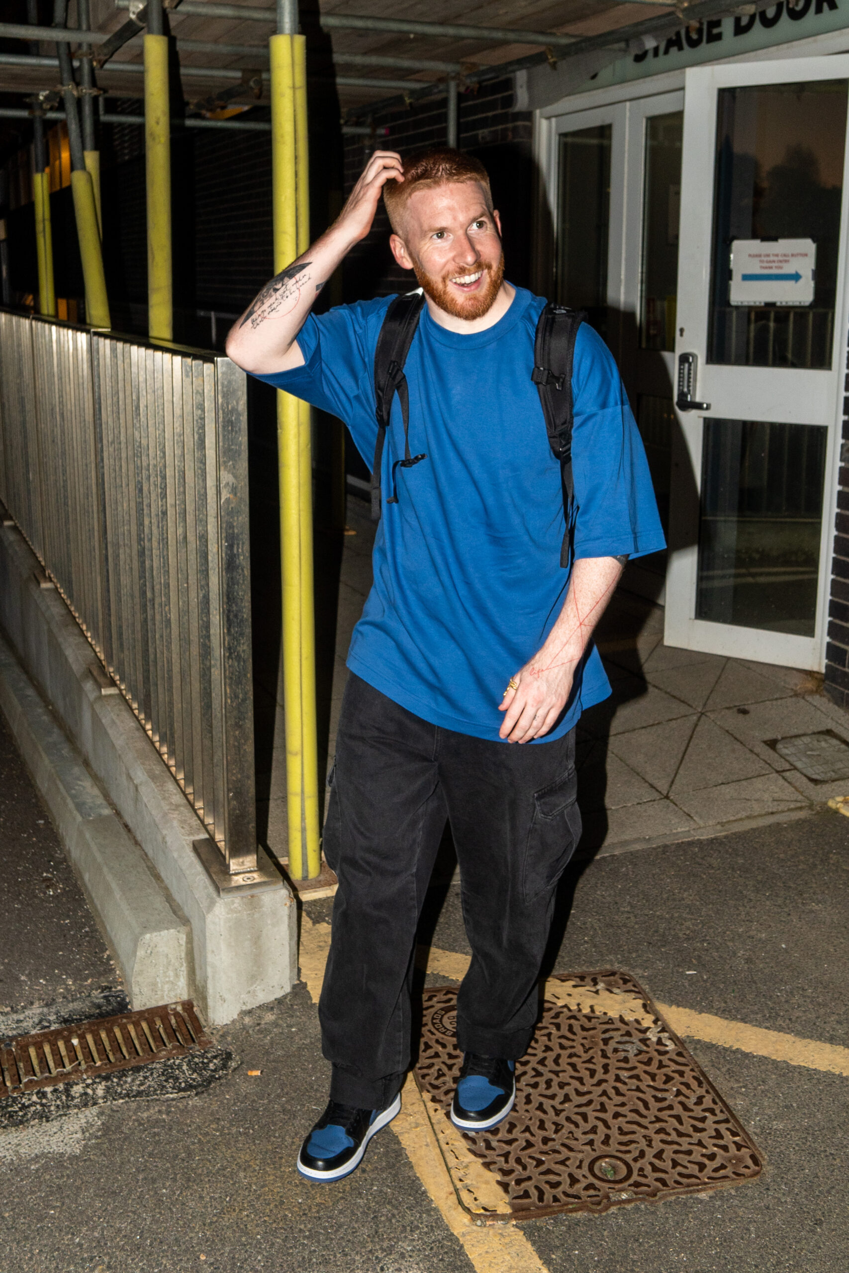 Neil Jones leaving Strictly studios wearing blue and smiling