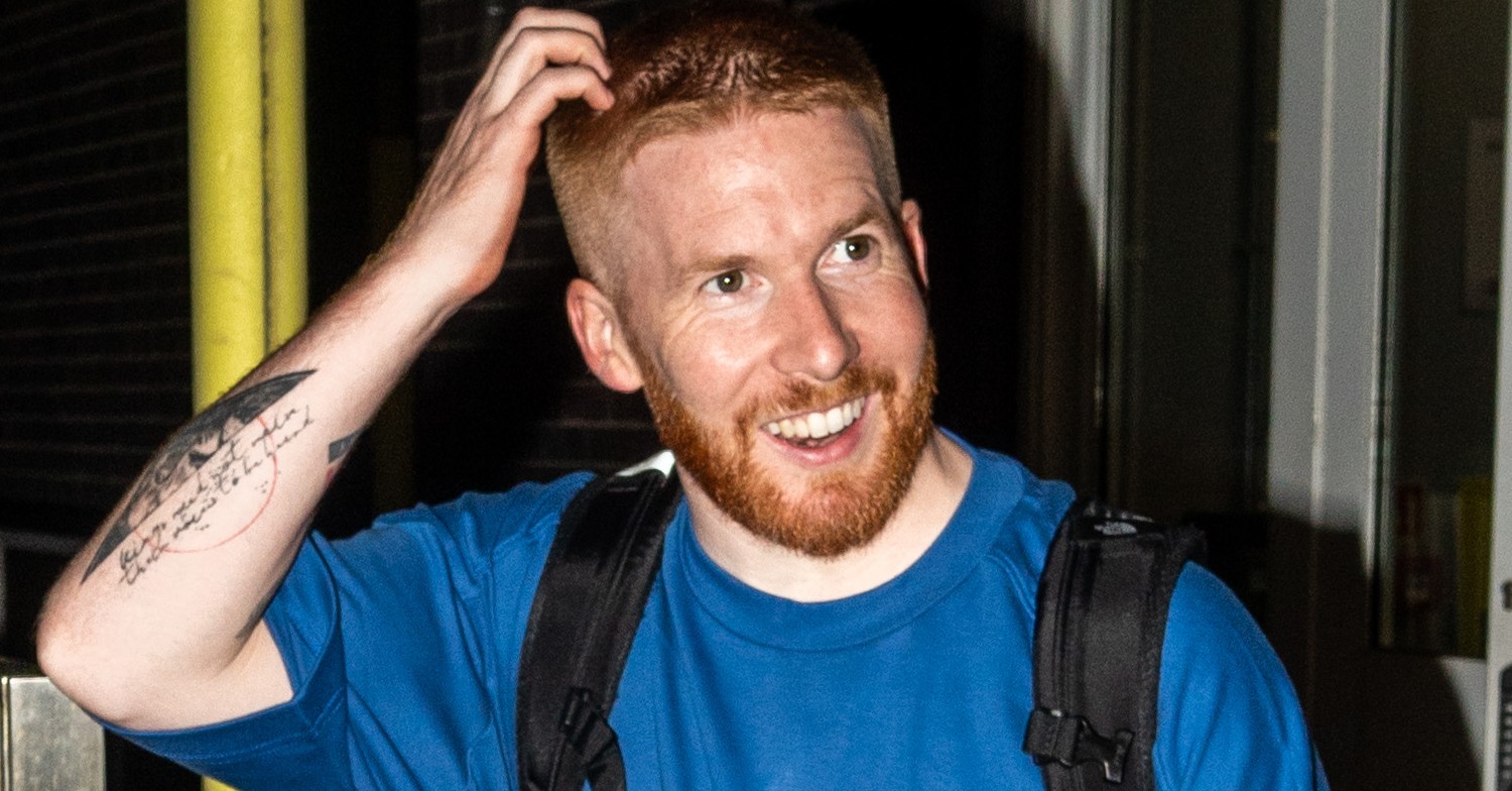 Neil Jones leaving Strictly studios wearing blue and smiling
