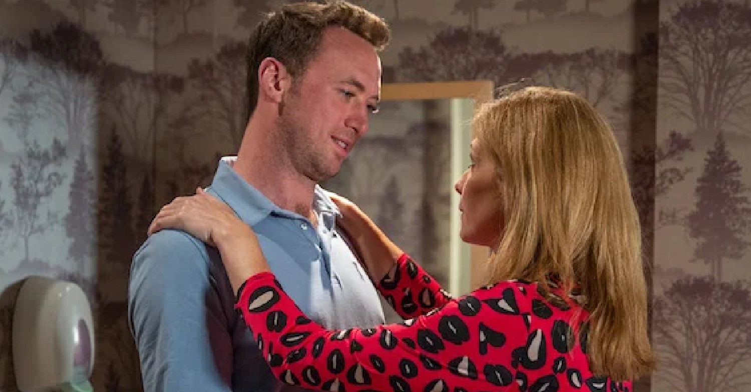 Emmerdale Liam and Bernice smile as they embrace