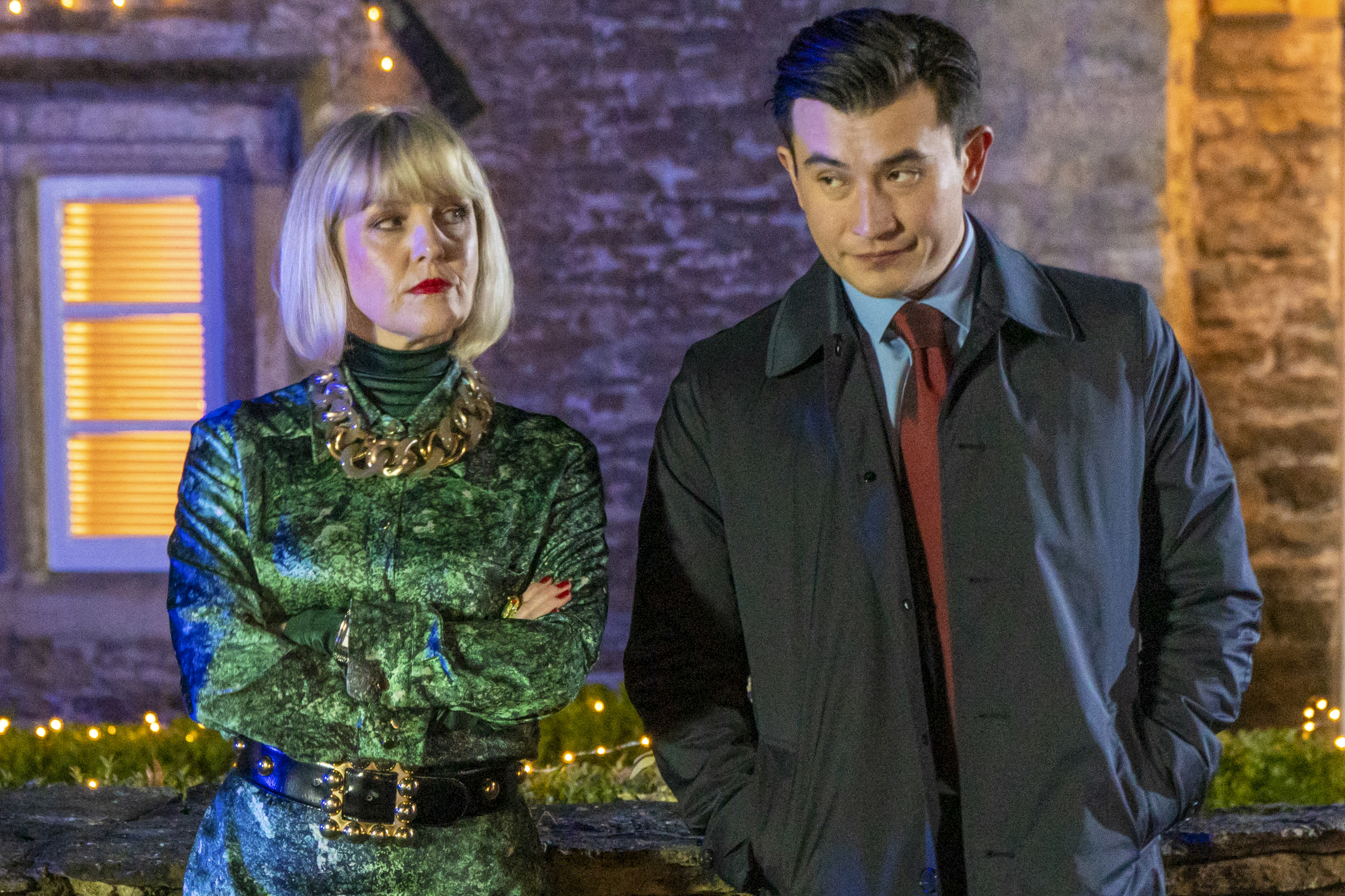 Ashley Jensen as Agatha Raisin next to Matt McCooey as Bill Wong in Kissing Christmas Goodbye