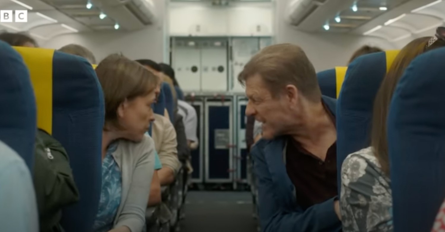 Sean Bean and Nicola Walker on plane talking over the aisle in Marriage