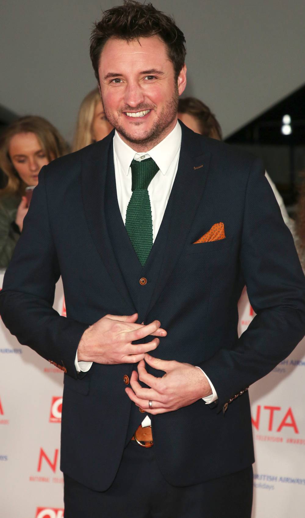 Strictly 2022 star James Bye crosses his fingers on the red carpet