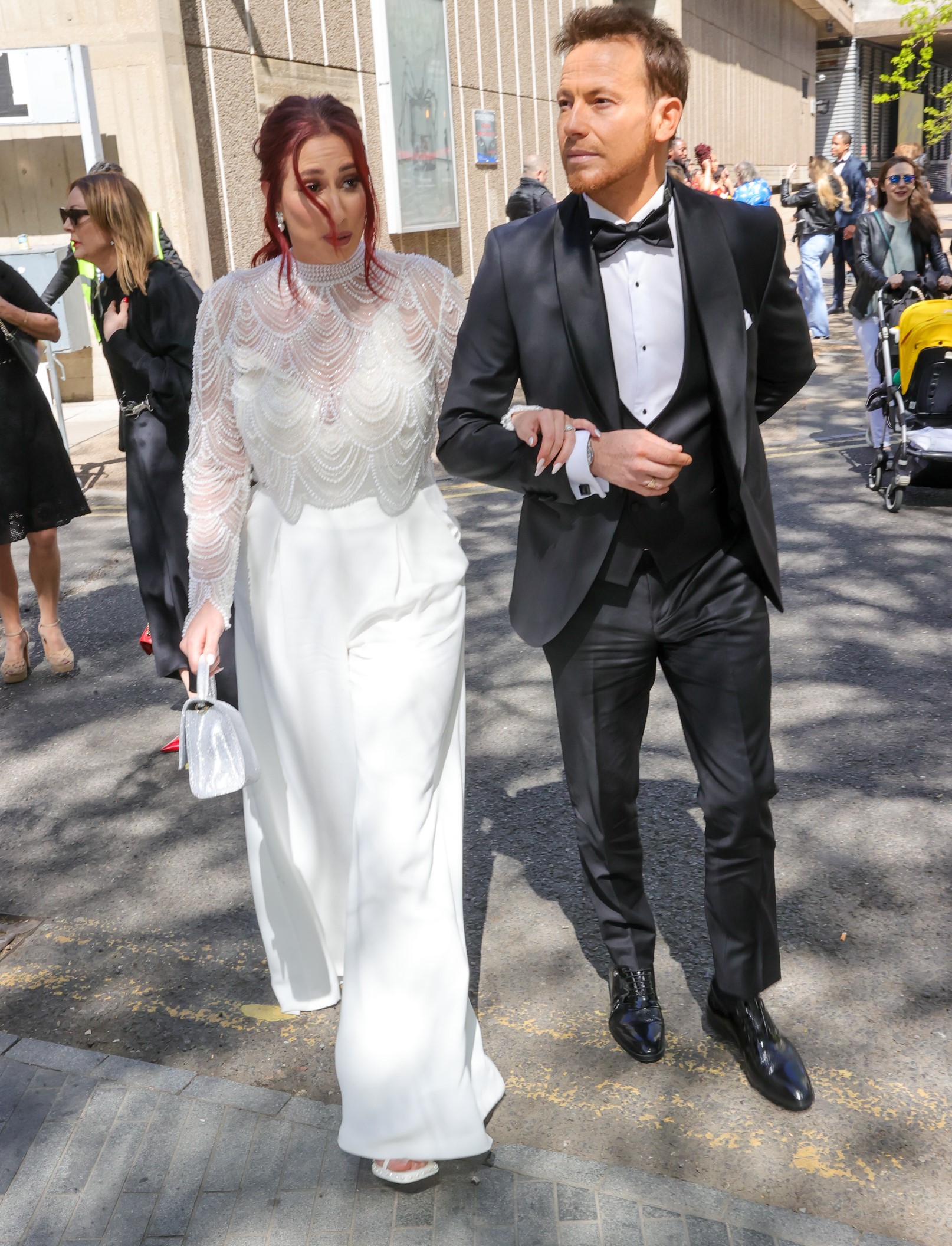 Stacey Solomon and Joe Swash walk arm-in-arm at event