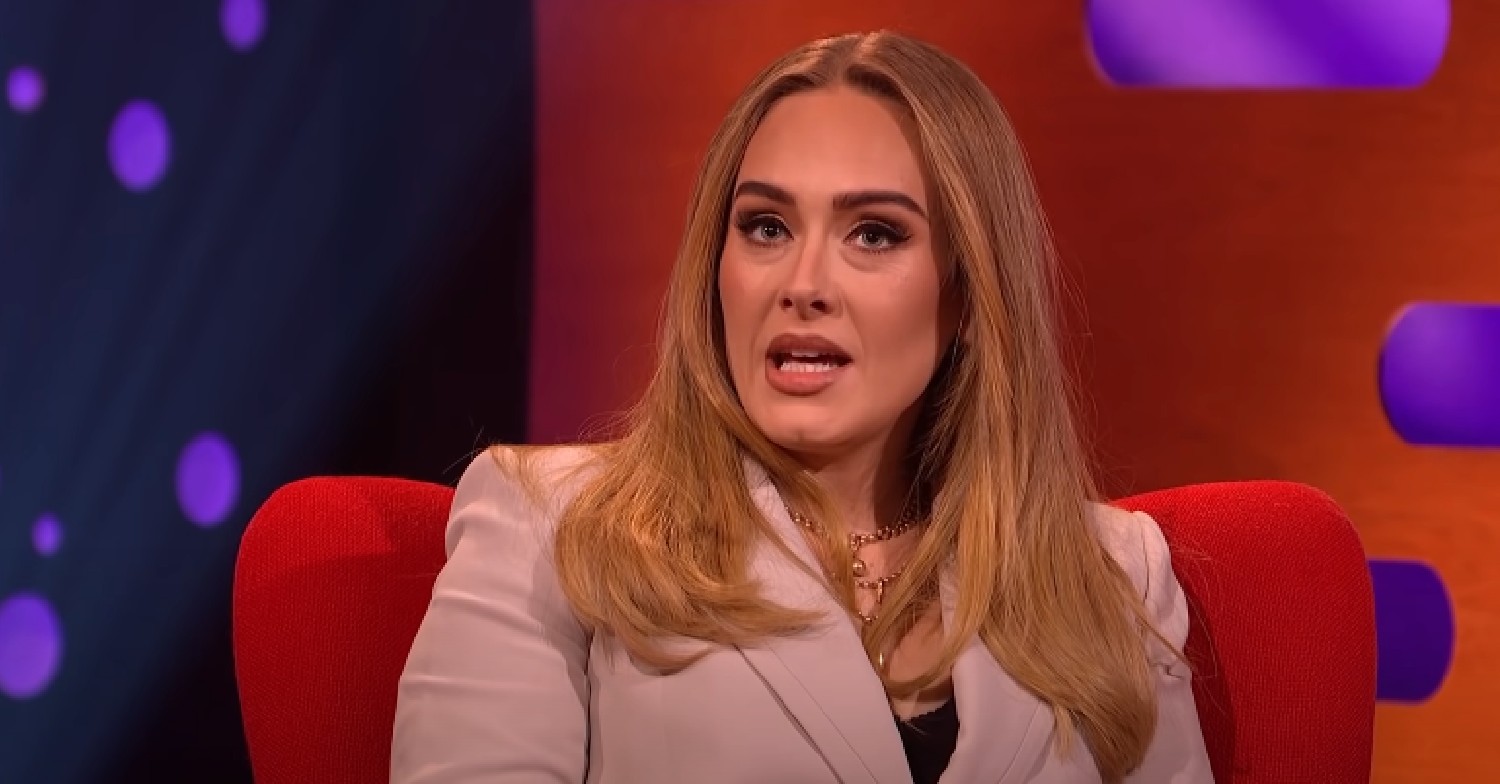Adele looking up and speaking on Graham Norton Show