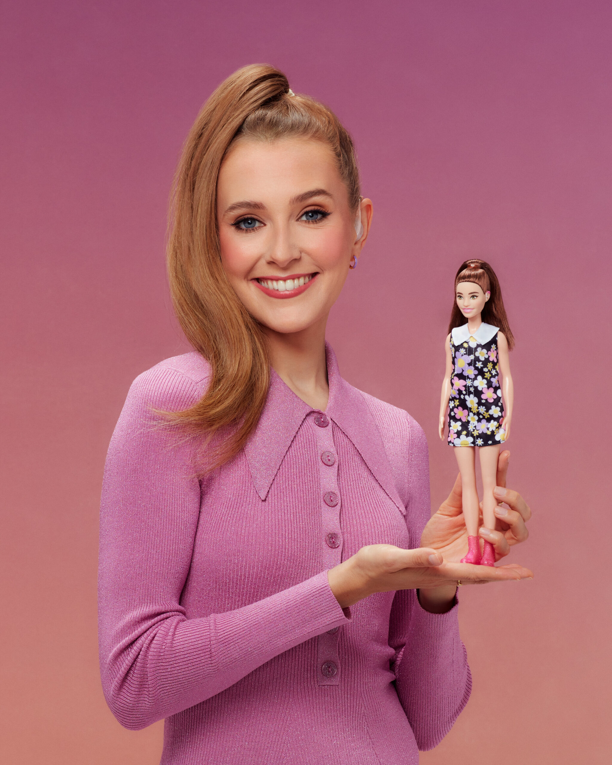 Rose Ayling-Ellis holding a Barbie doll in promo picture