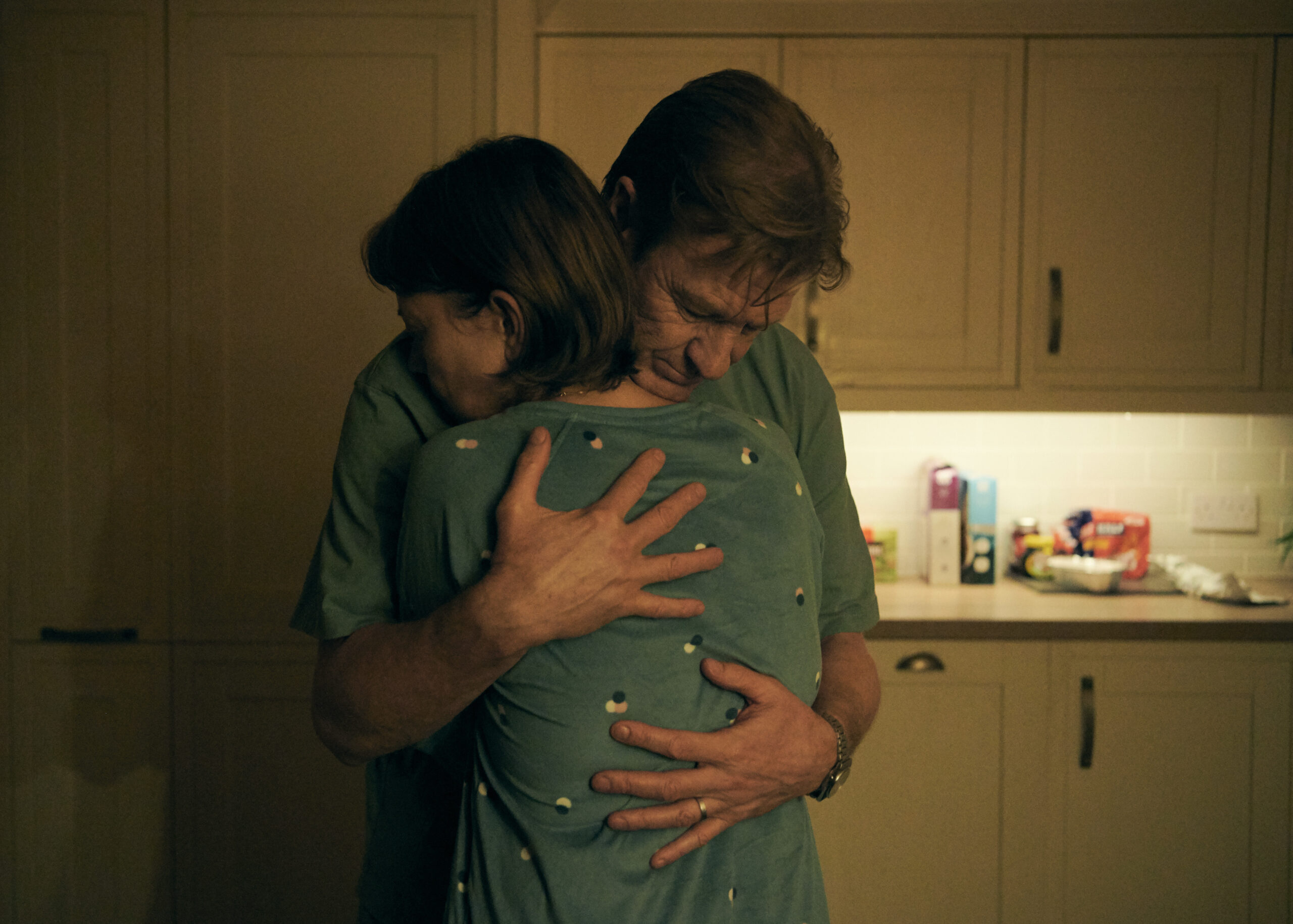 Sean bean as Ian hugs Nicola Walker as Emma