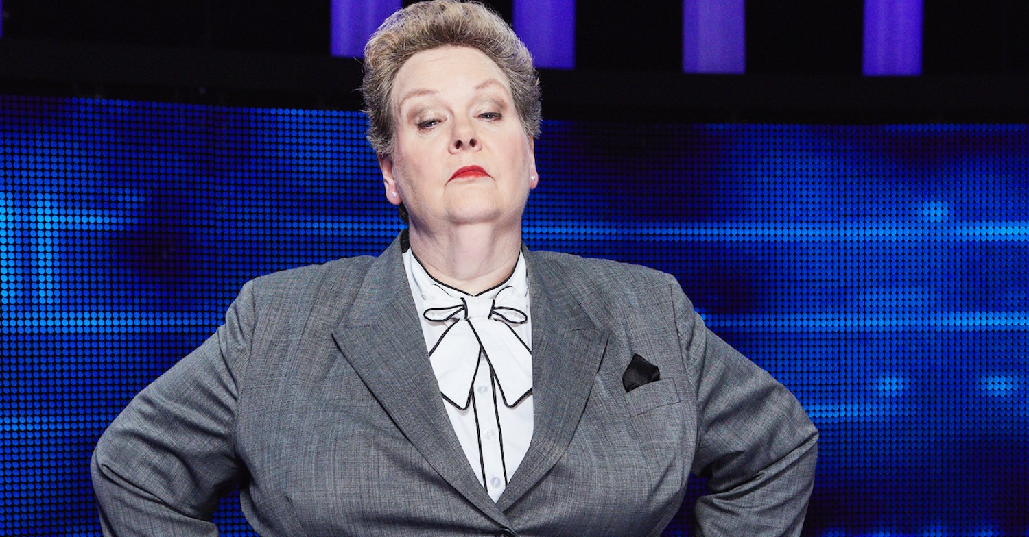 Anne Hegerty with a stern face and grey suit on The Chase