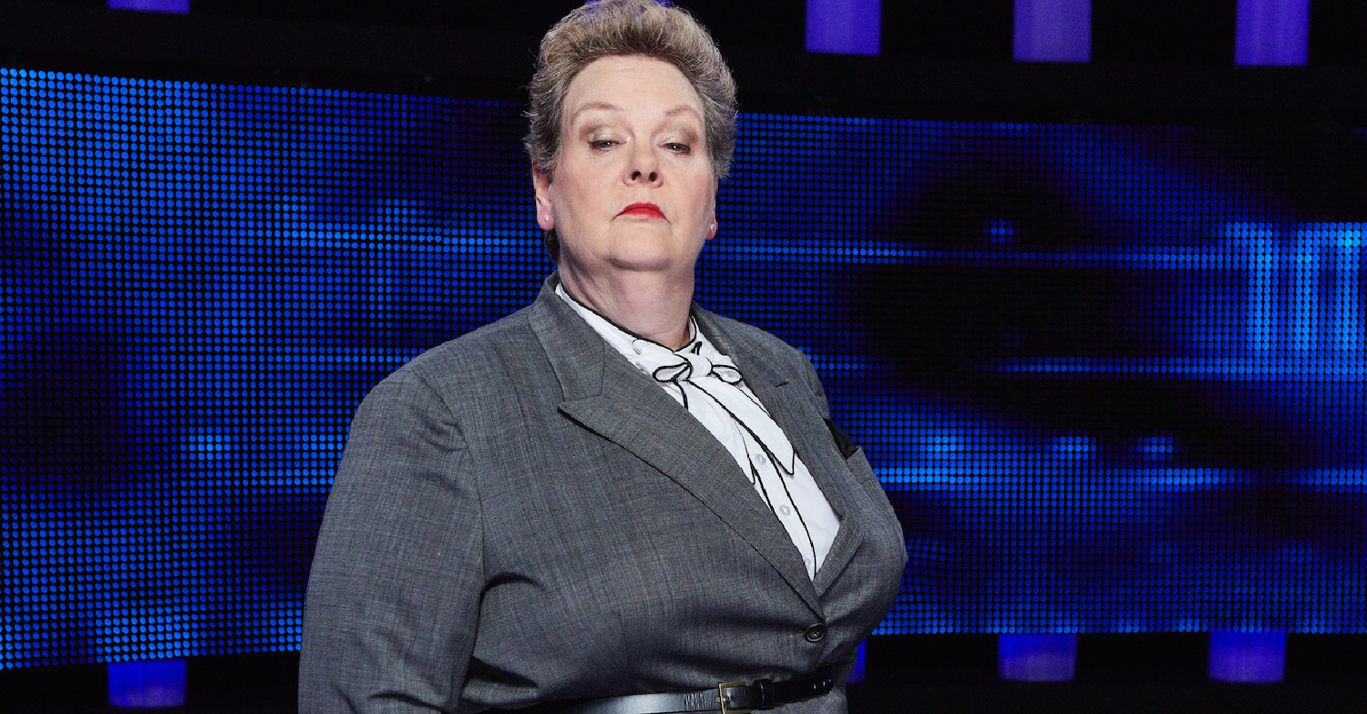 Anne Hegerty with a stern face and grey suit on The Chase
