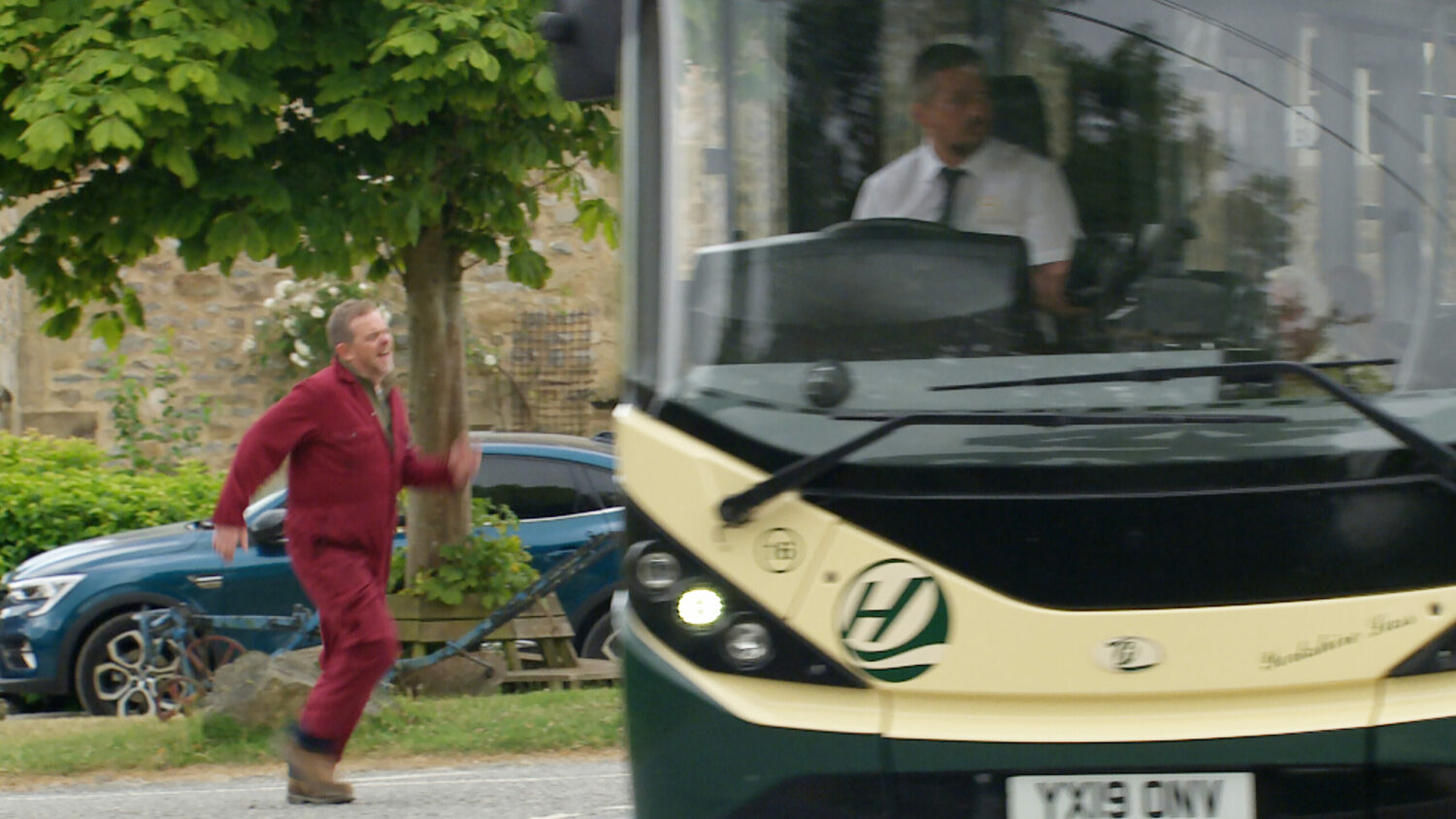 Dan running after the bus Emmerdale 
