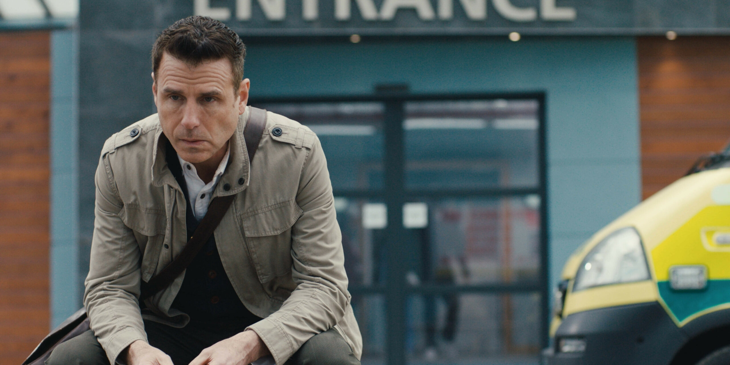 Casualty spoilers: David Hide looks deep in thought as he sits outside the ED