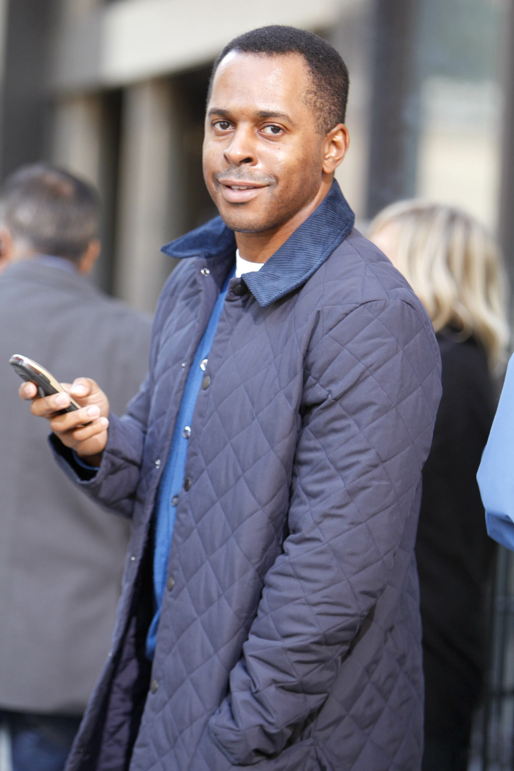 This Morning star Andi Peters texting on his phone outside the BBC Radio studios