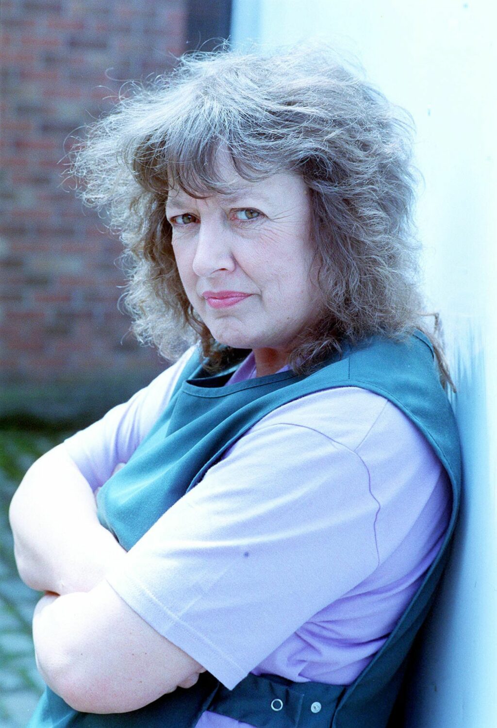 Coronation Street Edna Miller crossed her arms and looks grumpy