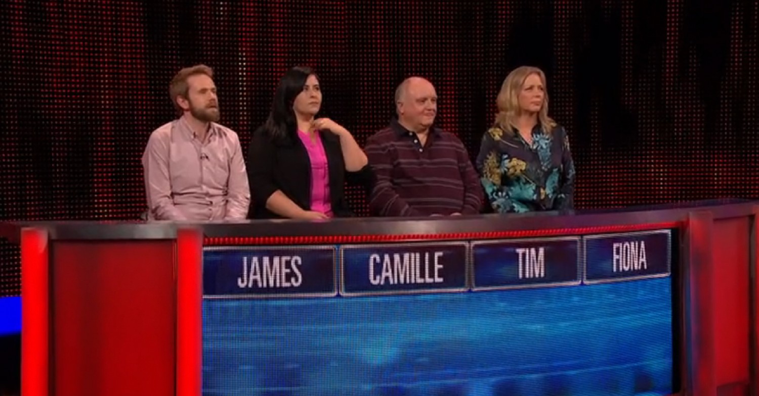 Contestants on The Chase standing behind panel