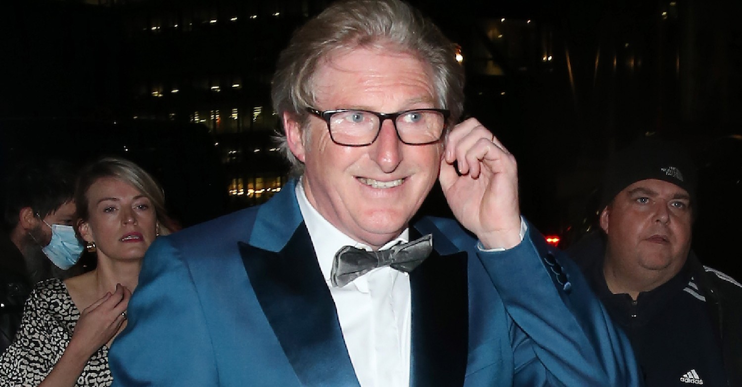 Adrian Dunbar dressed smartly on red carpet at night