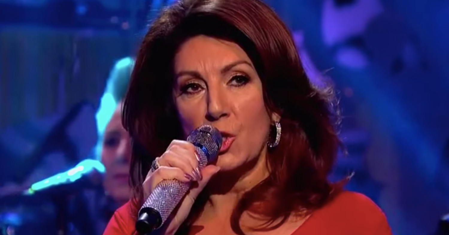 Jane McDonald singing with a microphone
