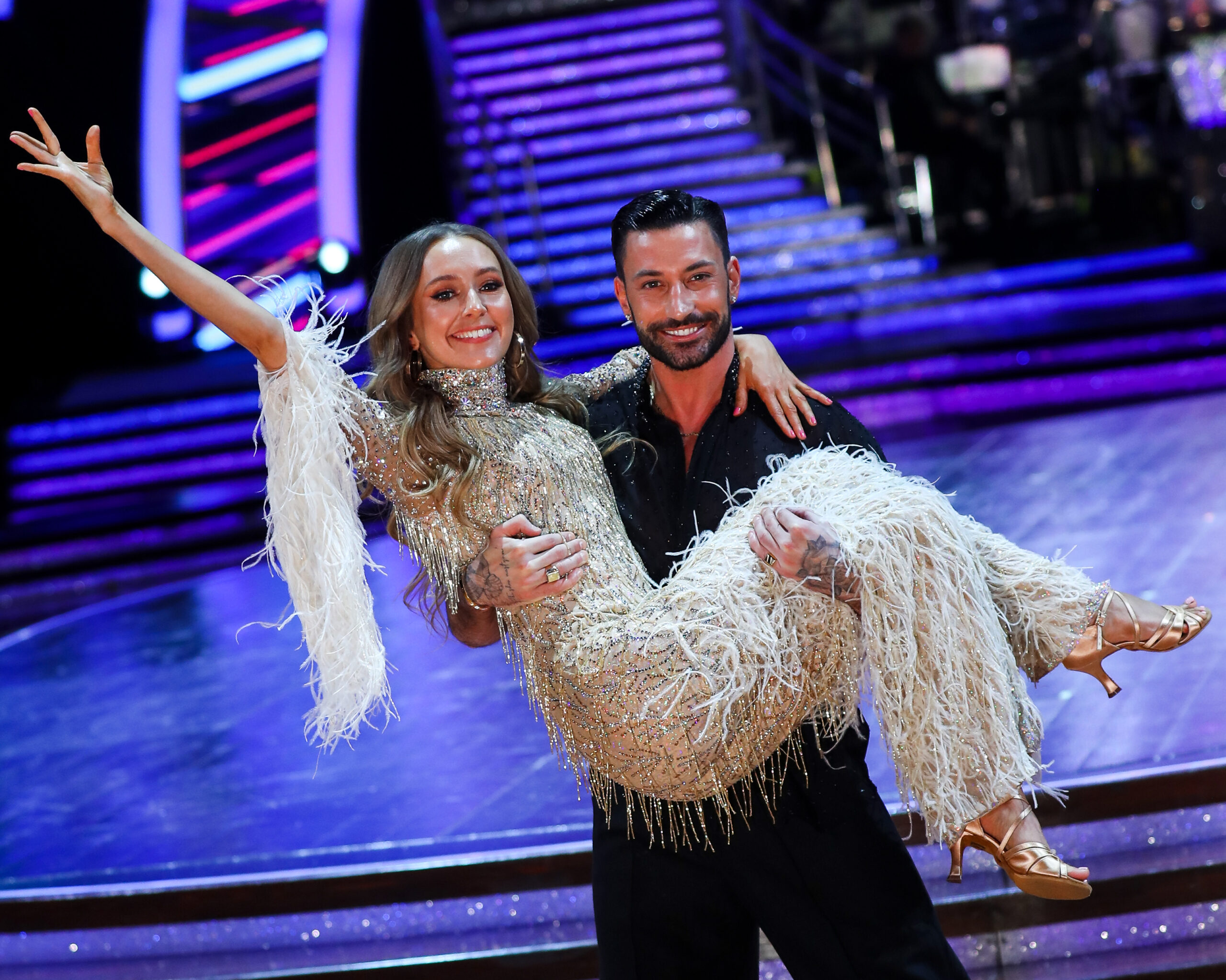 Rose Ayling-Ellis being held by dancing partner Giovanni Pernice in the Strictly ballroom, last years winners. 