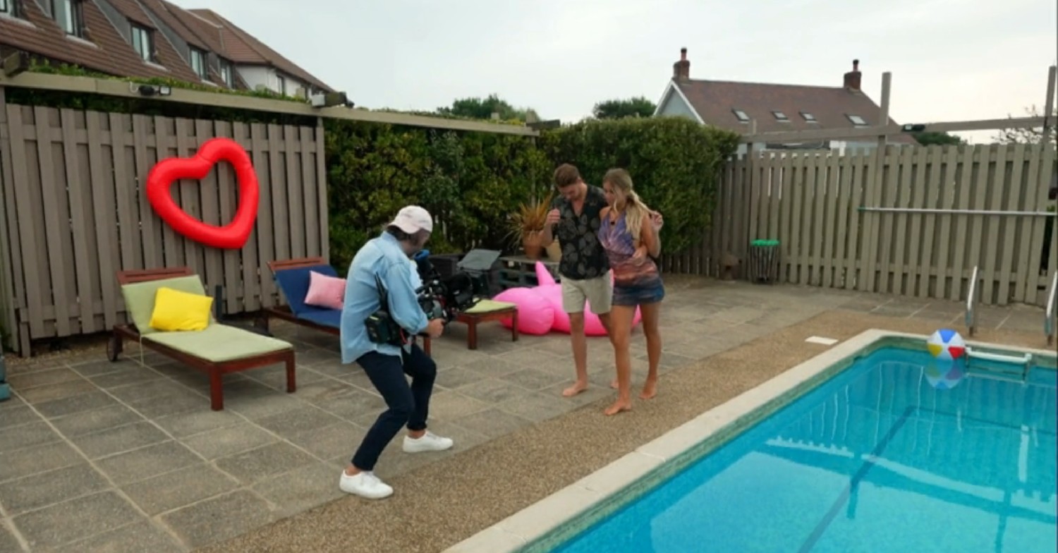 Andrew and Tasha being filmed next to a swimming pool on This Morning today