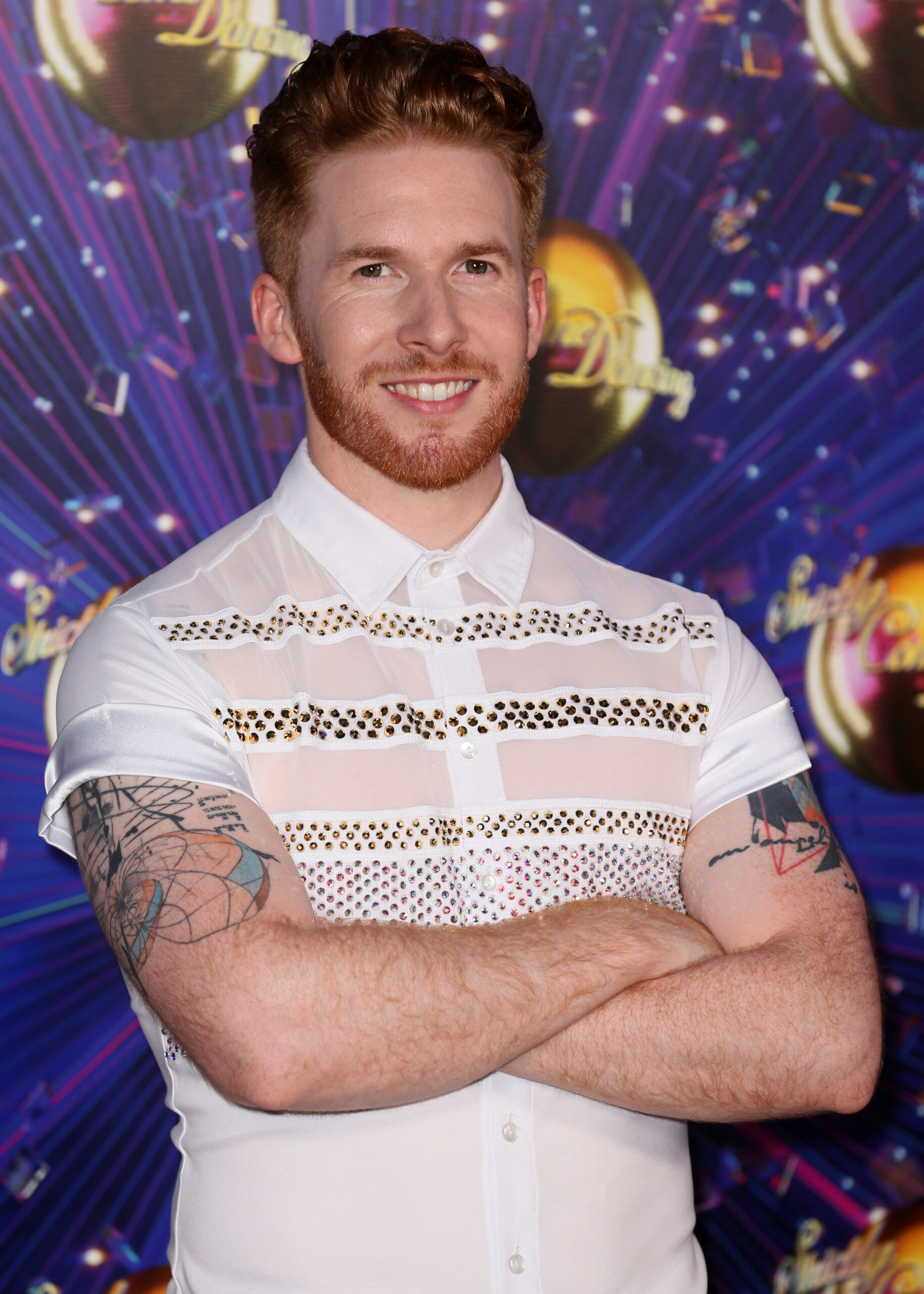 Neil Jones smiles at the Strictly launch in 2019