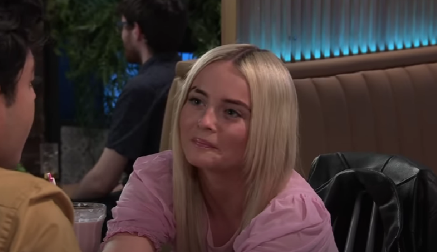 Kelly smiling at Aadi Coronation Street