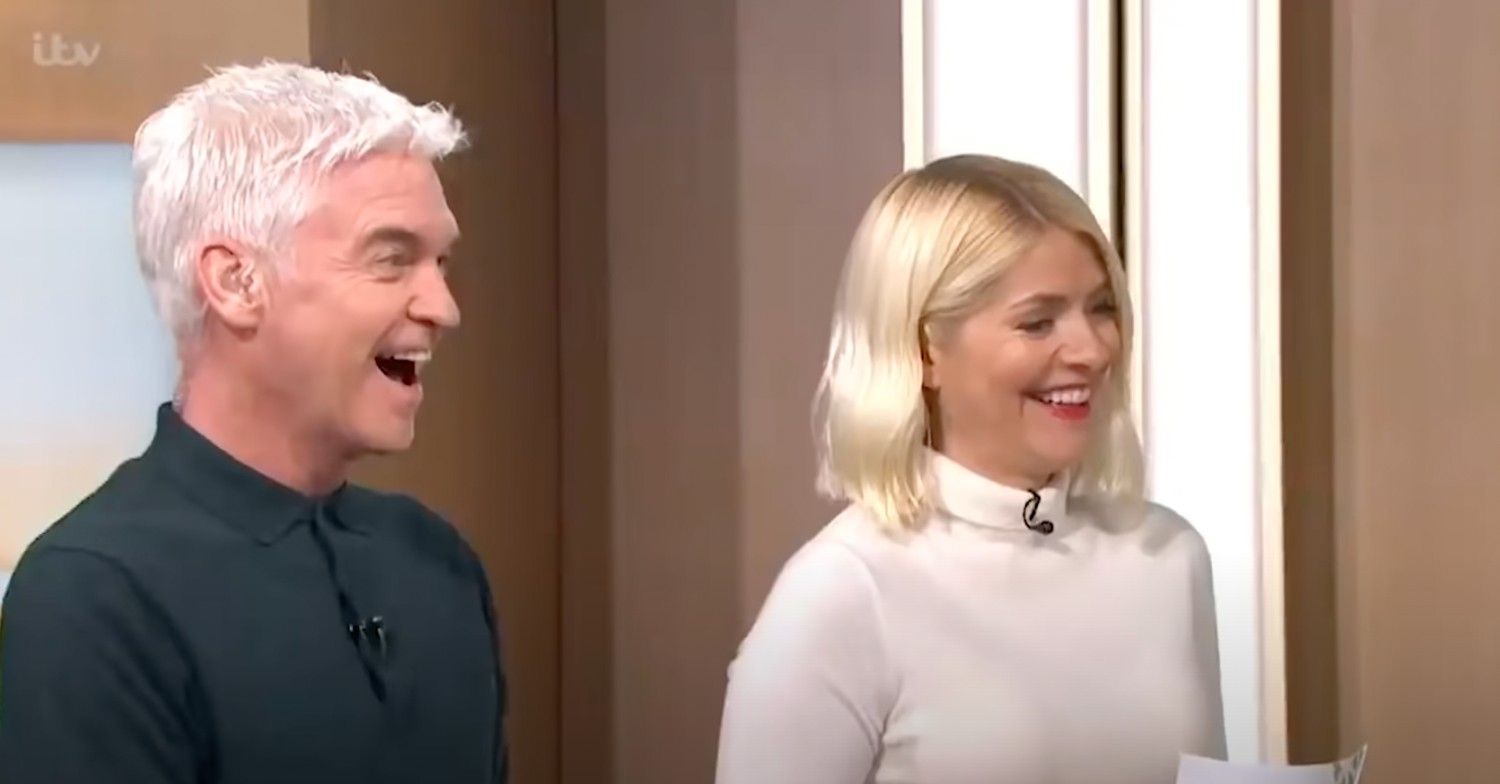 Holly Willoughby in a white turtle neck presenting This Morning with Phillip Schofield