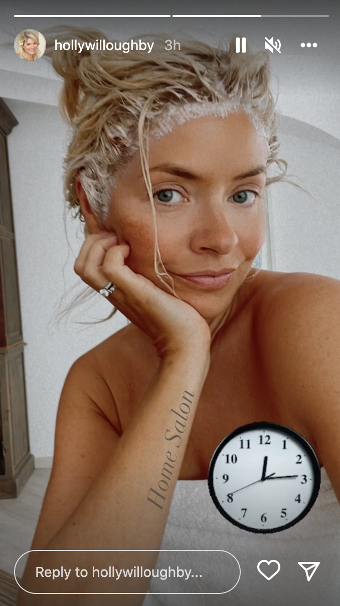 Holly Willoughby with no make up on and a towel round her body