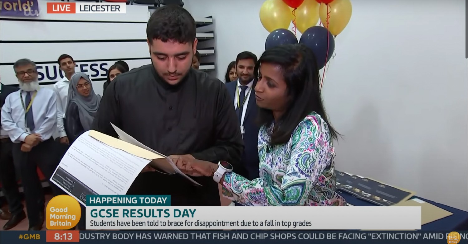 Student opening his GCSE results on GMB 