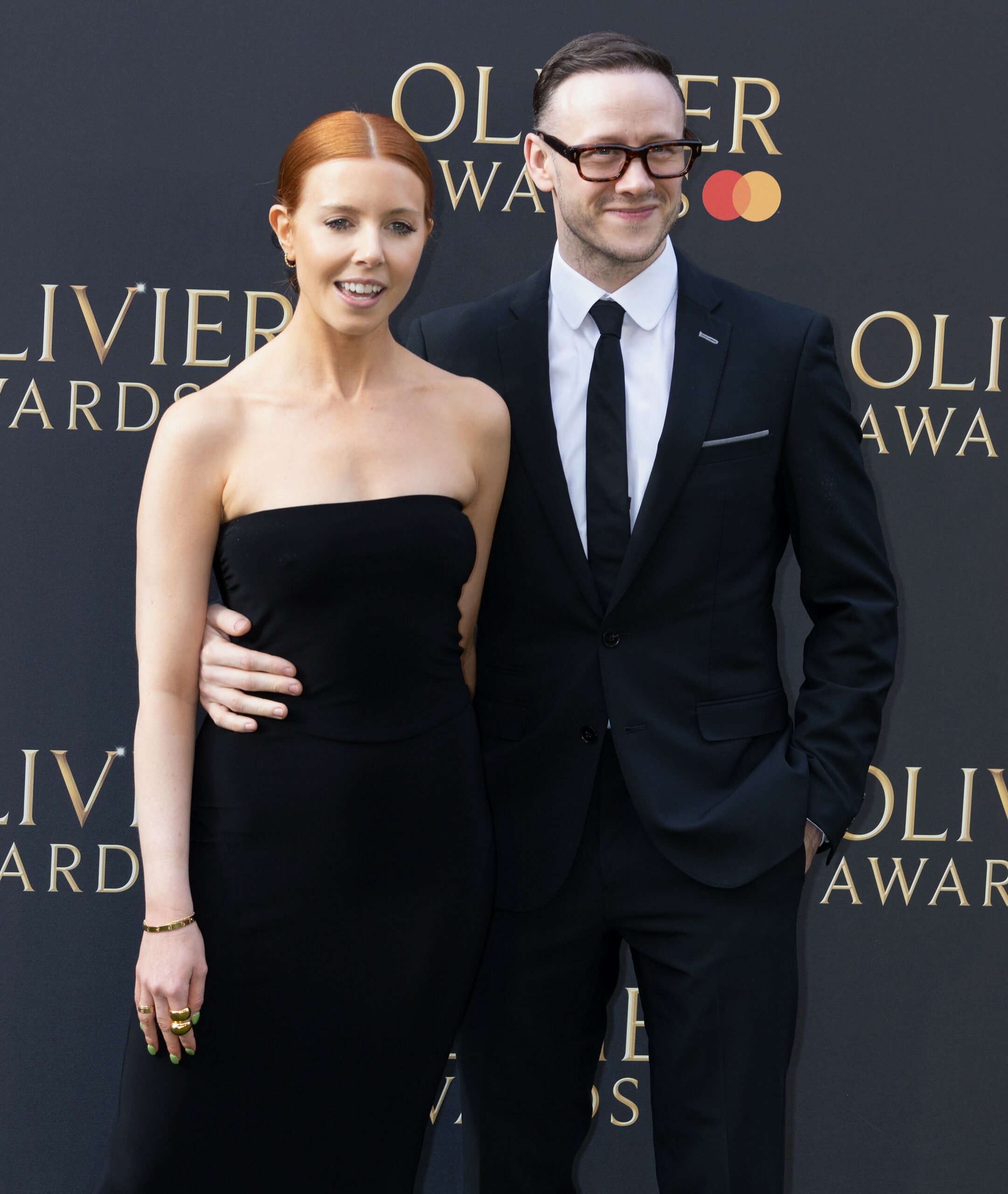 Stacey Dooley and Kevin Clifton smile at Olivier Awards
