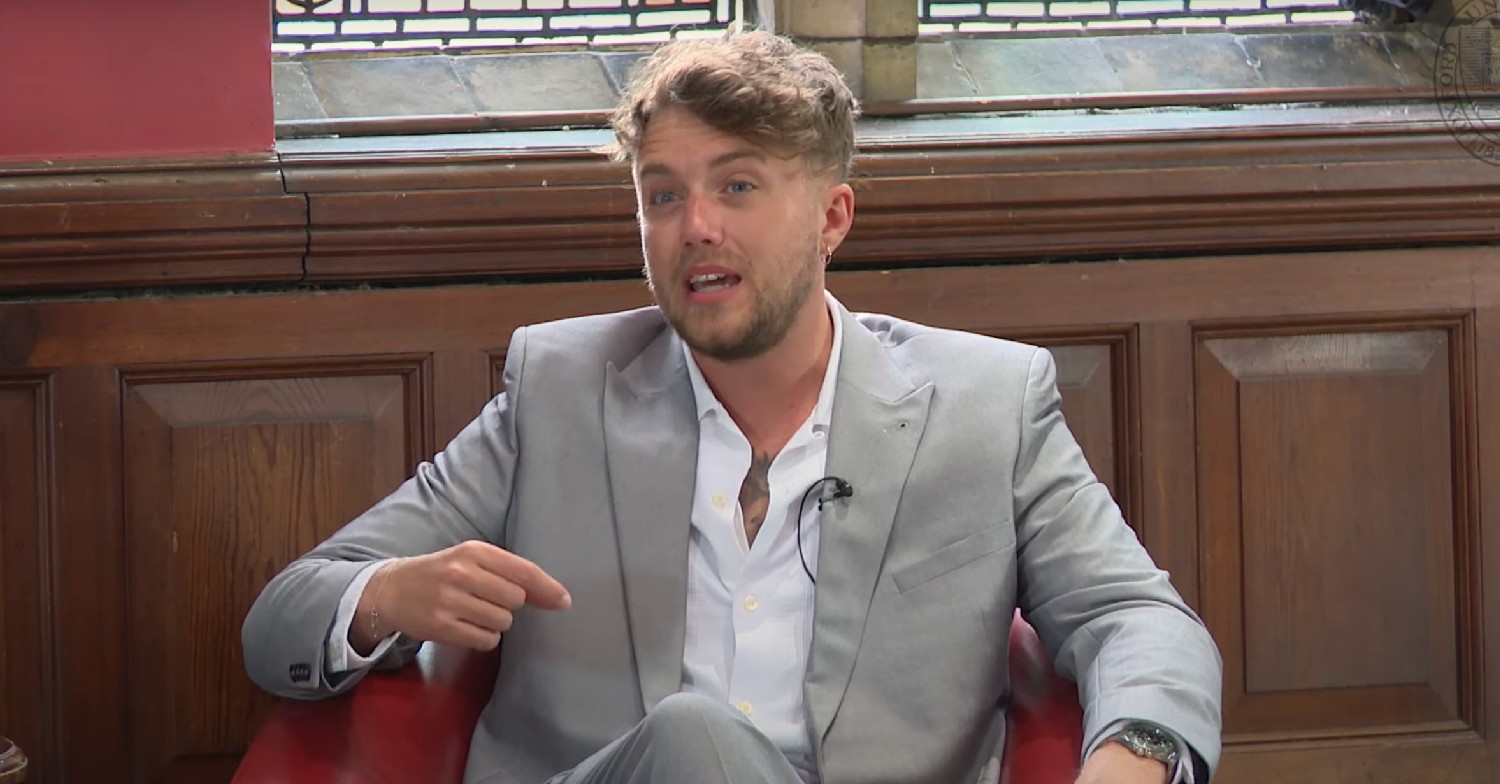 Roman Kemp wearing a suit, speaking