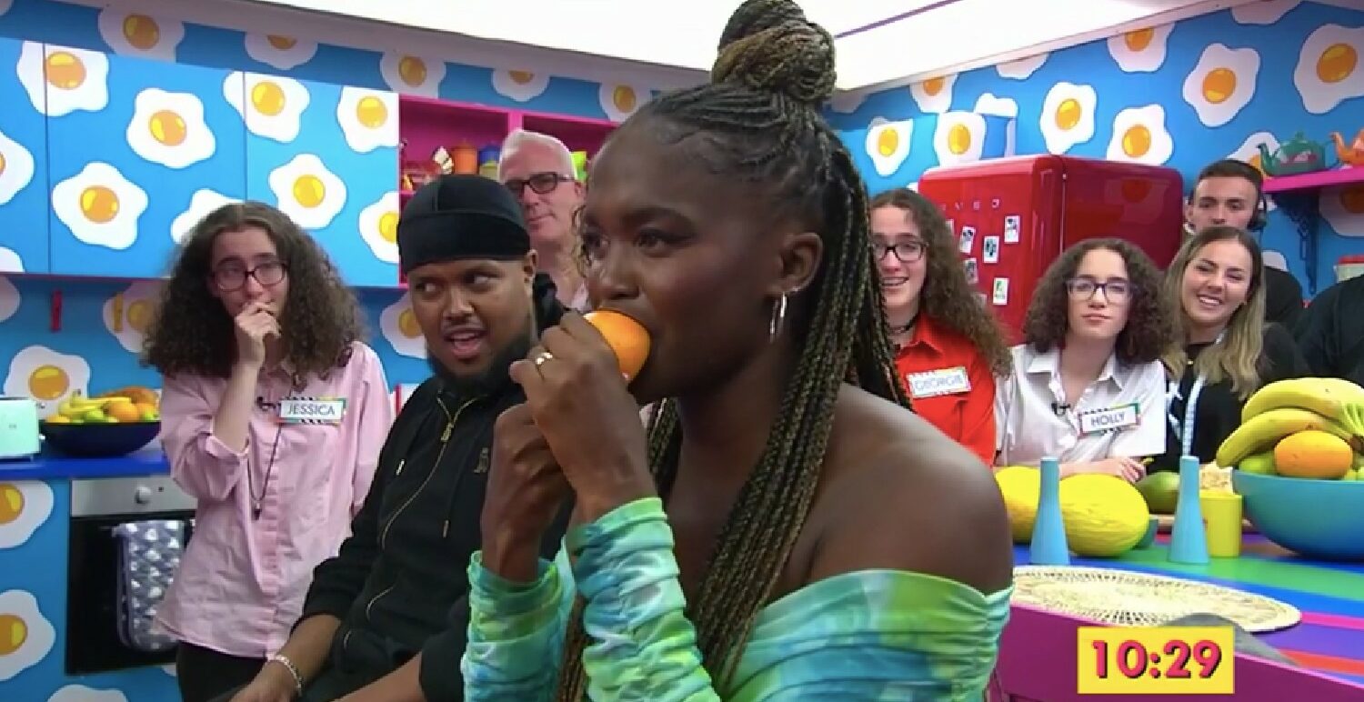 Oti Mabuse eating an orange on Channel 4 The Big Breakfast
