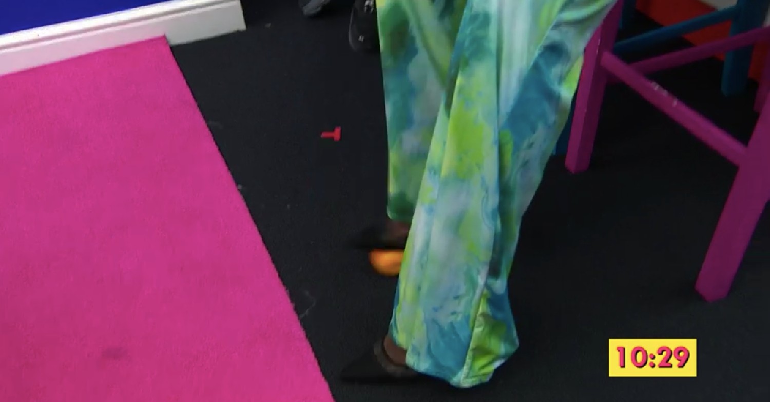 Oti Mabuse rolling an orange with her feet on Channel 4 The Big Breakfast