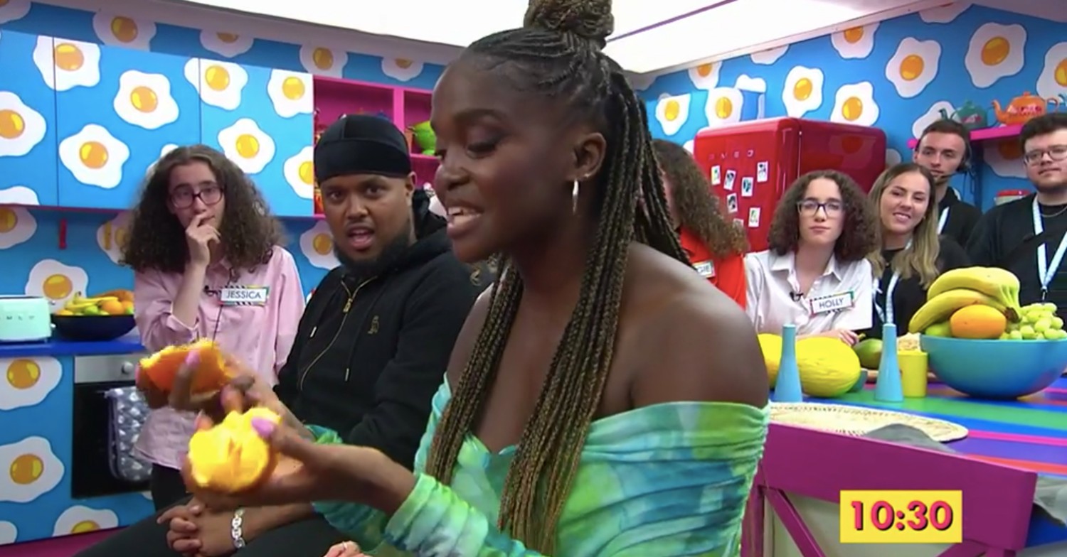 Oti Mabuse looking at an orange on Channel 4 The Big Breakfast