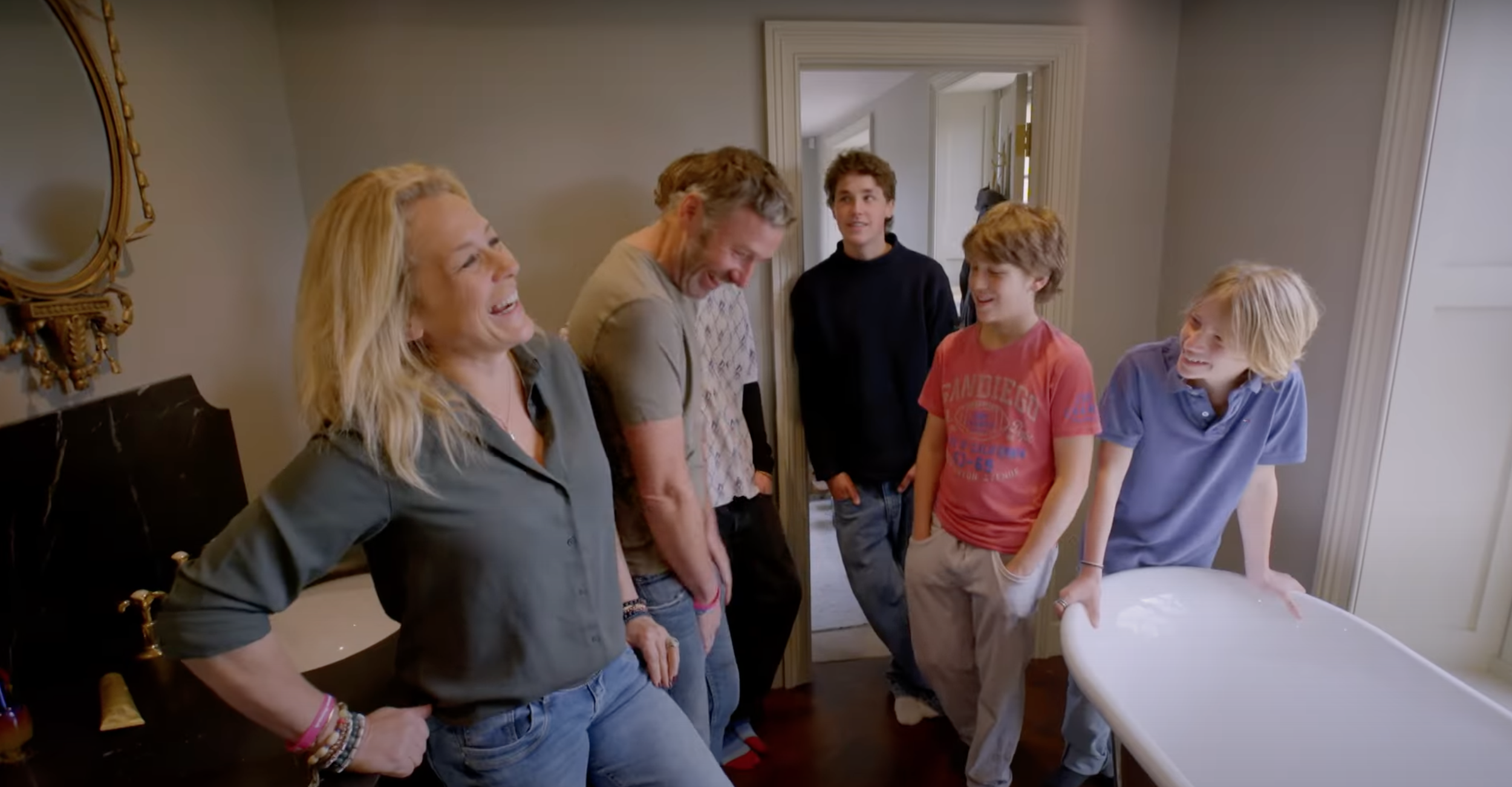Sarah Beeny laughing with her husband and four children