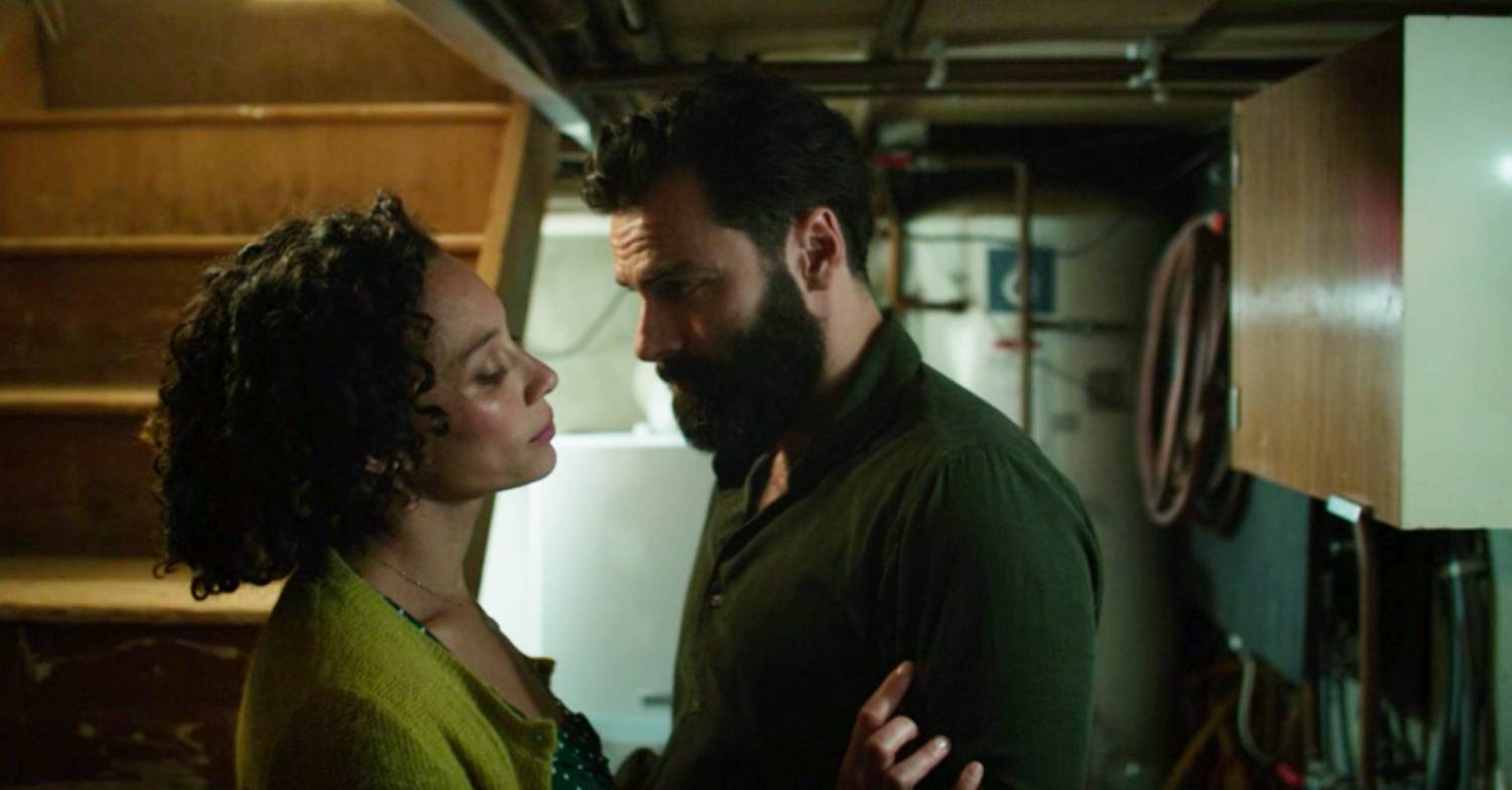 Dr Joe and his wife embrace in the cellar in the first episode of The Suspect on ITV