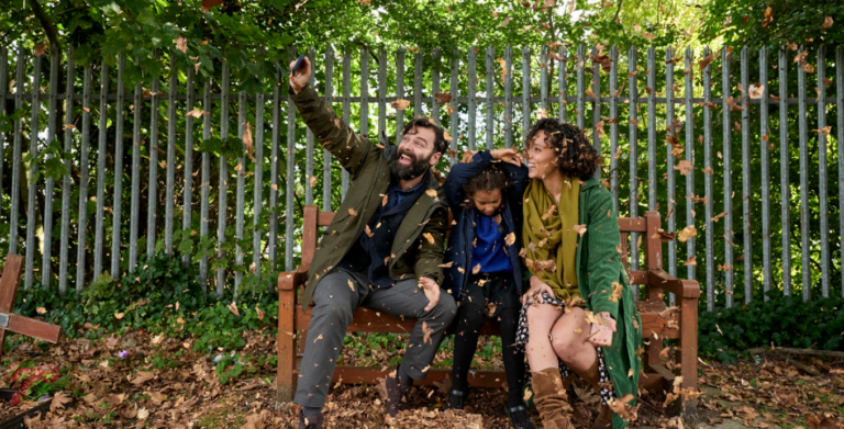 Camilla Beeput and Aidan Turner grinning on a bench in The Suspect on ITV