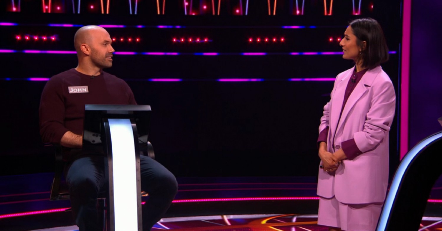 Anita Rani speaking to a contestant on Fastest Finger First