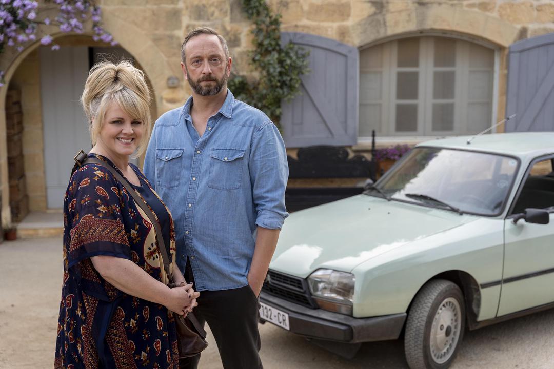 Sally Lindsey (Left) as Jean and Steve Edge (right) as Dom outside his taxi