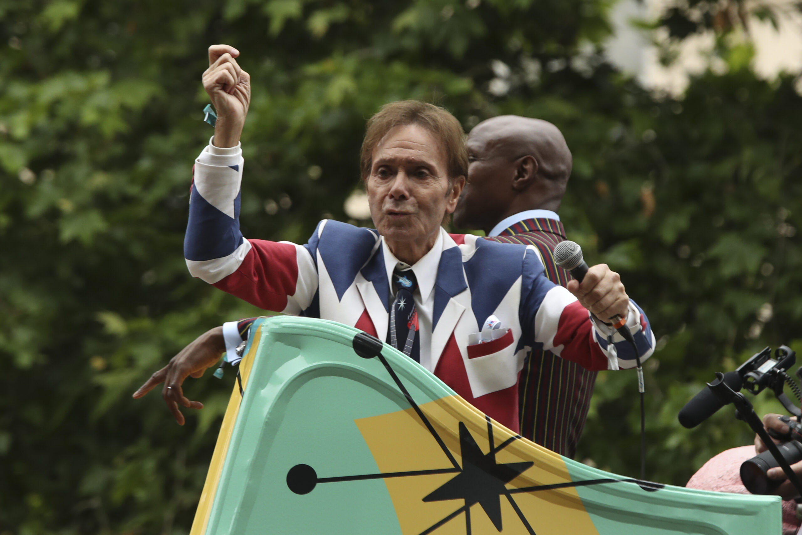 Sir Cliff Richard wearing a union jack suit