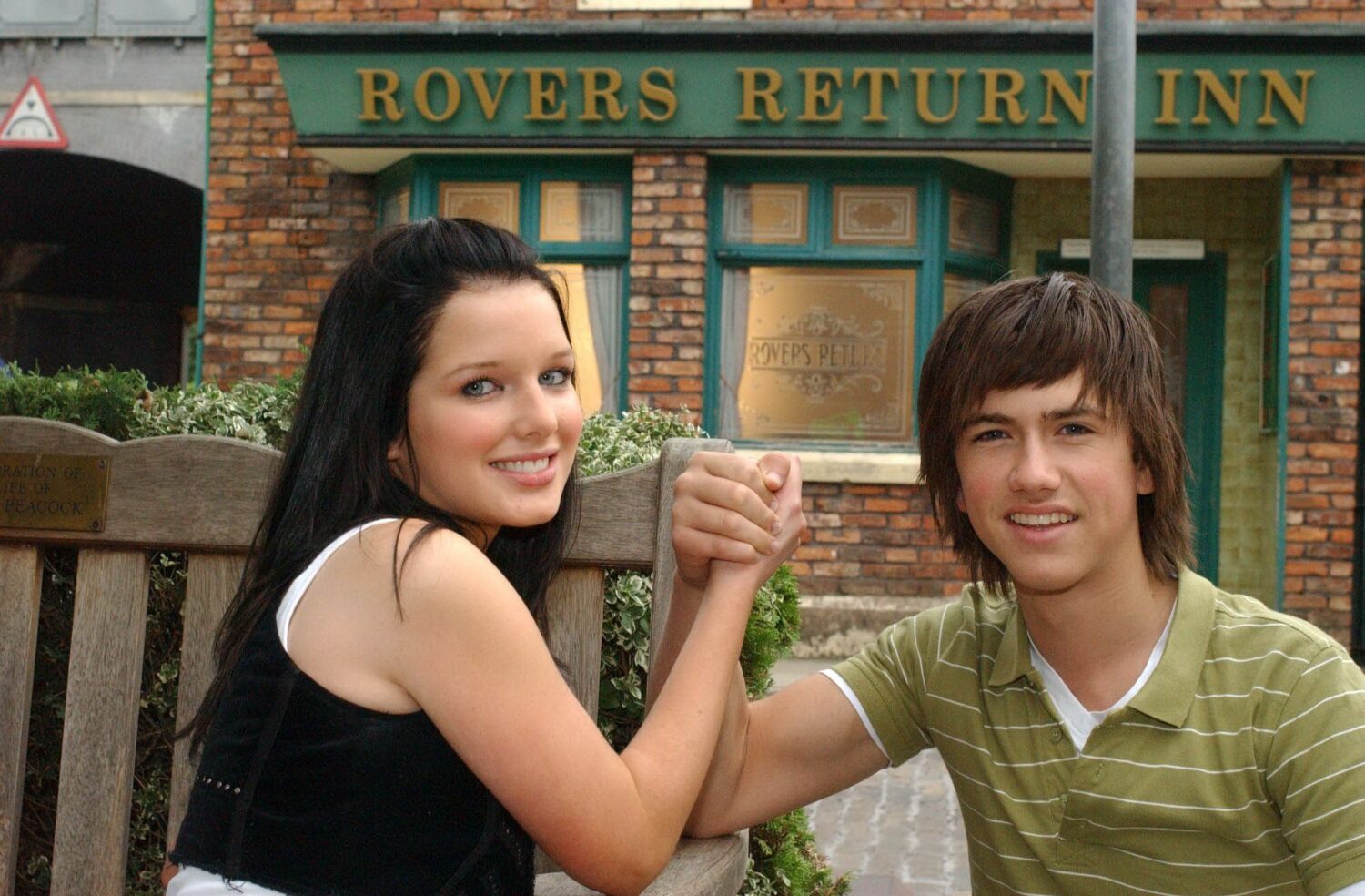 Rosie Webster and Craig Harris smile as the join hands on Coronation Street