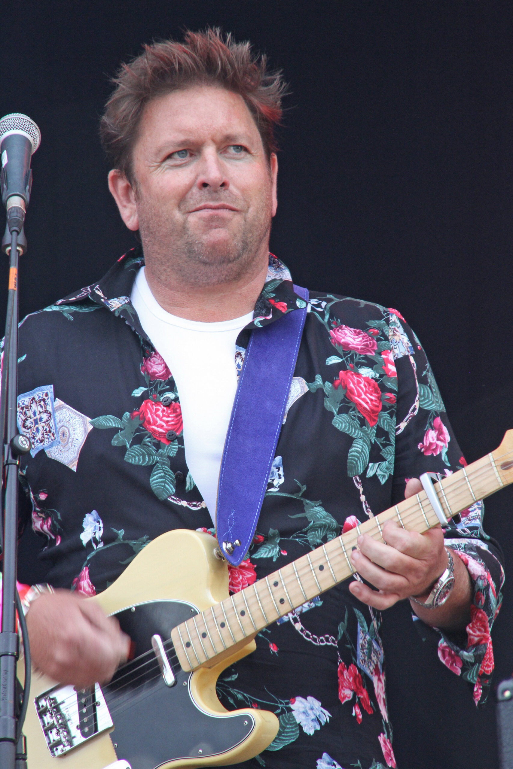 TV Chef James Martin playing the guitar on stage