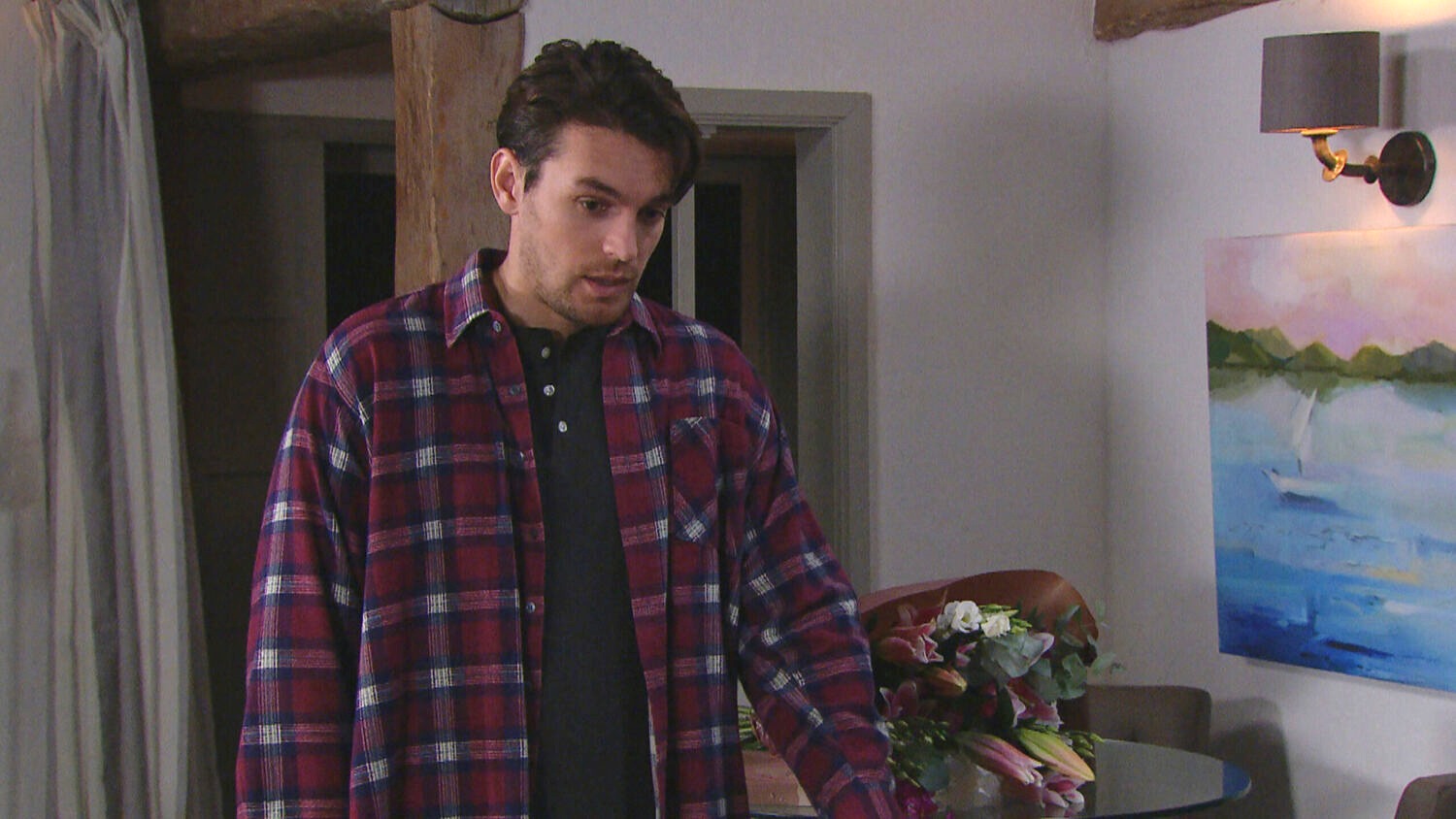 Emmerdale's Mack looking shifty at Charity's home