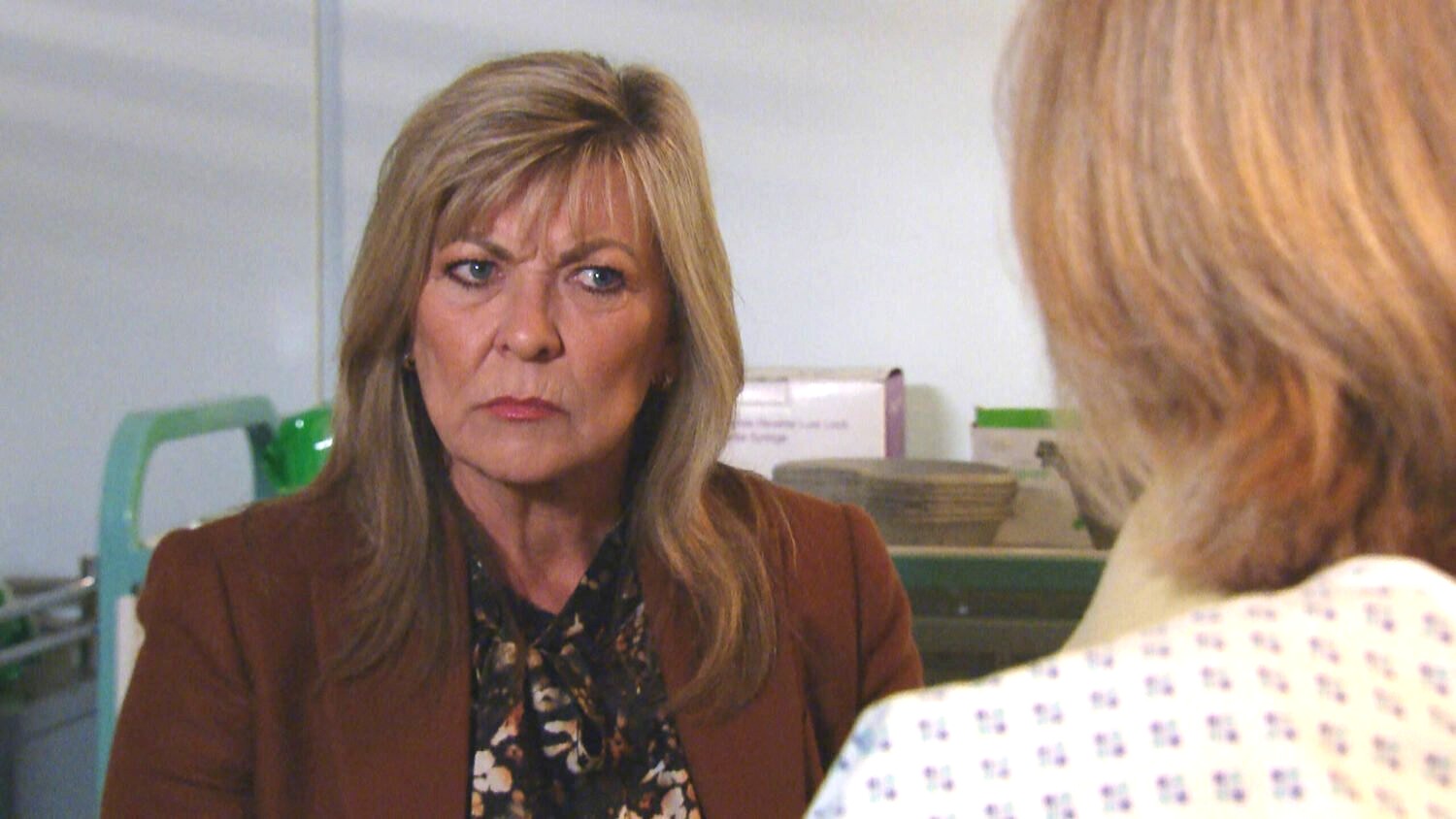 Kim Tate in Emmerdale looks confused and angry as she talks to Hazel