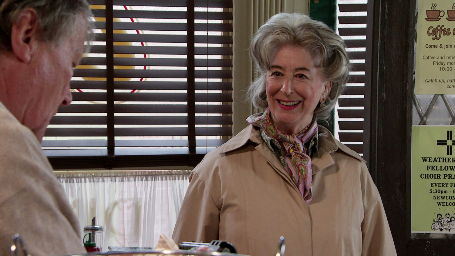 Coronation Street Evelyn smiles at Roy in the cafe